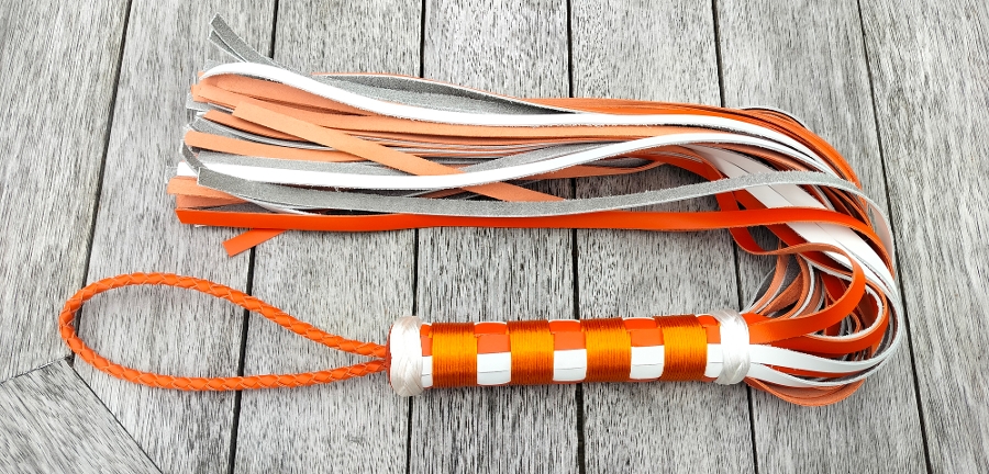 Orange and white thud flogger